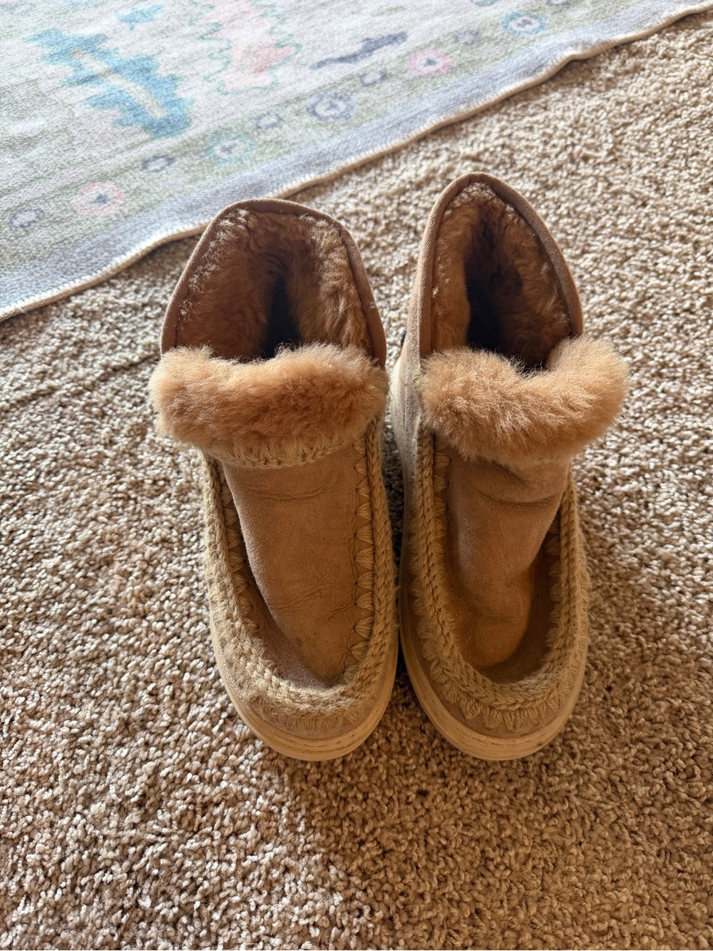 Mou Tan Shearling-Trim Winter Moccasin Boots with embellished name on back.